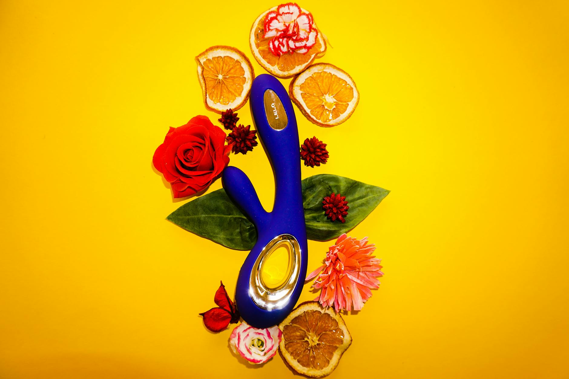 A hand holding a fresh lemon against a bright yellow background, symbolizing rediscovery and renewal.