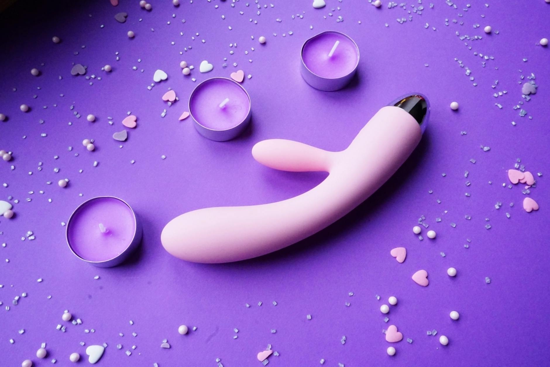 A lemon vibrator arranged with candles and romantic ambiance for couples intimacy